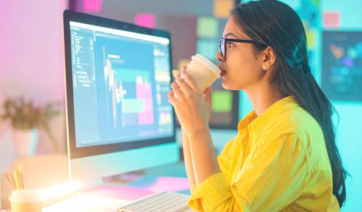 An asian female sipping her coffee while looking at her iMac screen, depicting adding quizzes to her Wordpress site.