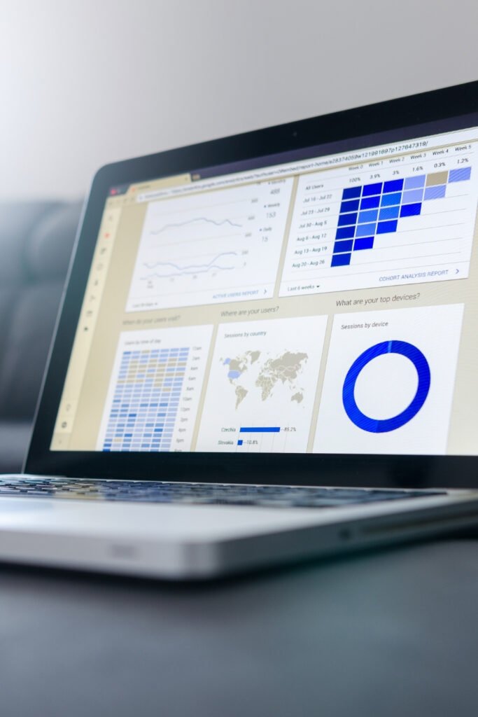 Open laptop with bar charts and data visualisation on the screen for non-designers