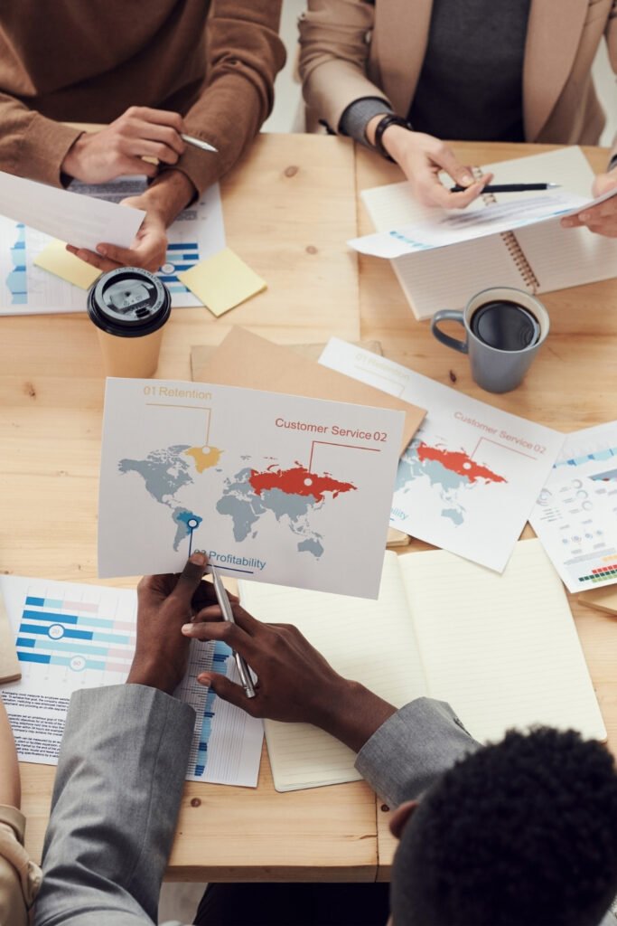 Design collaboration with team, showing graphics an diagrams