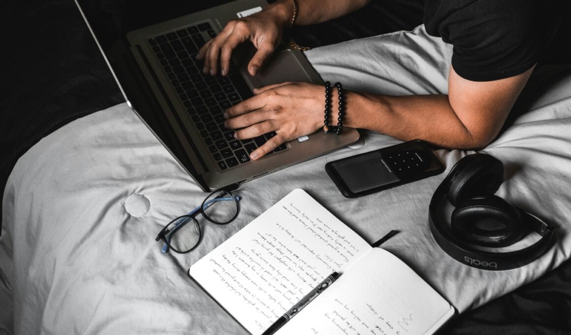 Man typing on laptop representing a side hustle income.