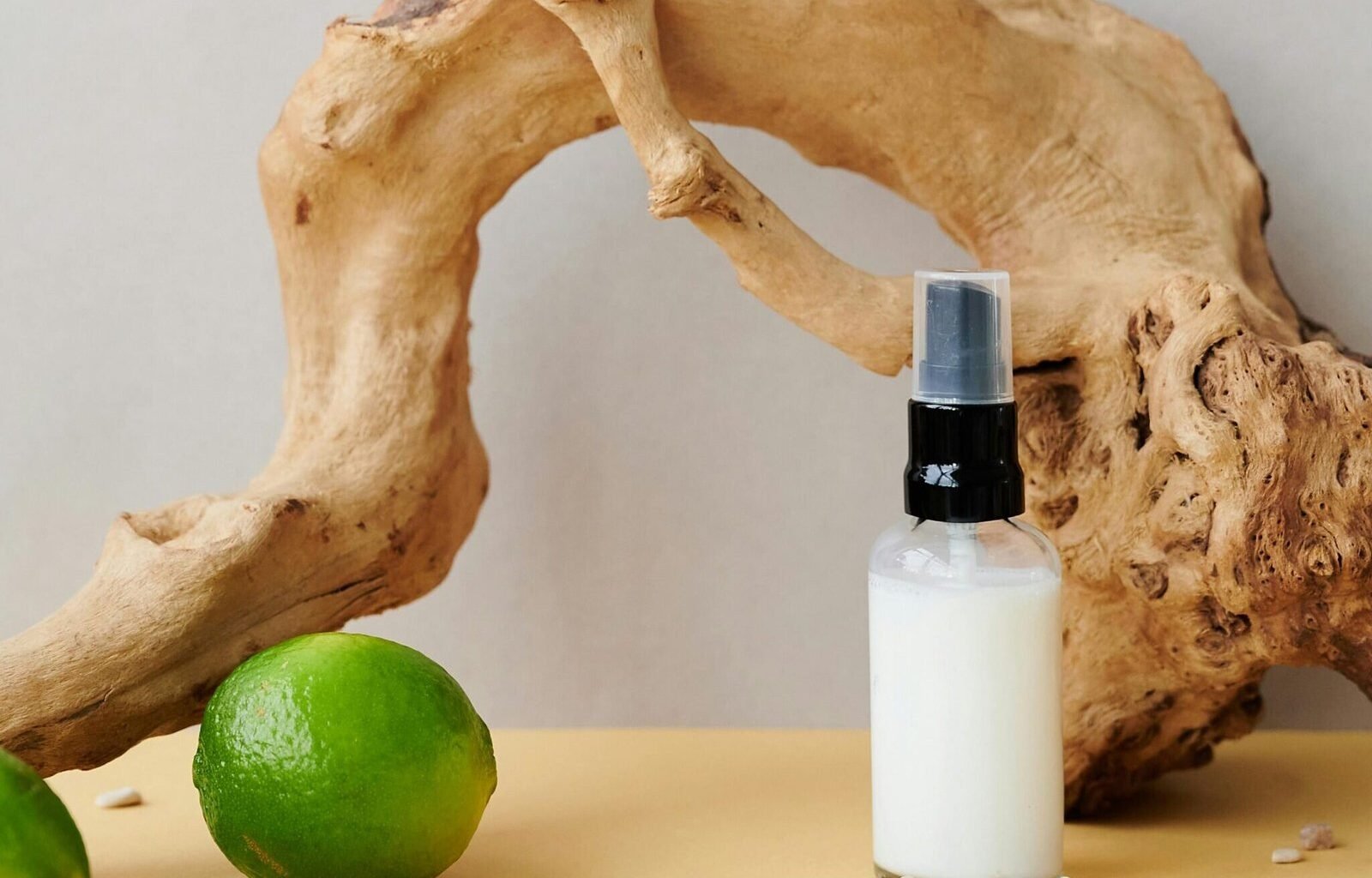 Allergen-free All-Purpose Cleaner - Bottle with natural ingredients next to a lime.