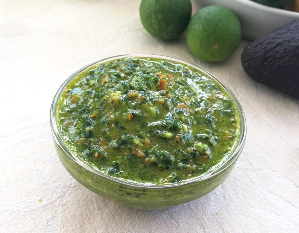 Small condiment bowl filled with green Kale pepper pesto recipe